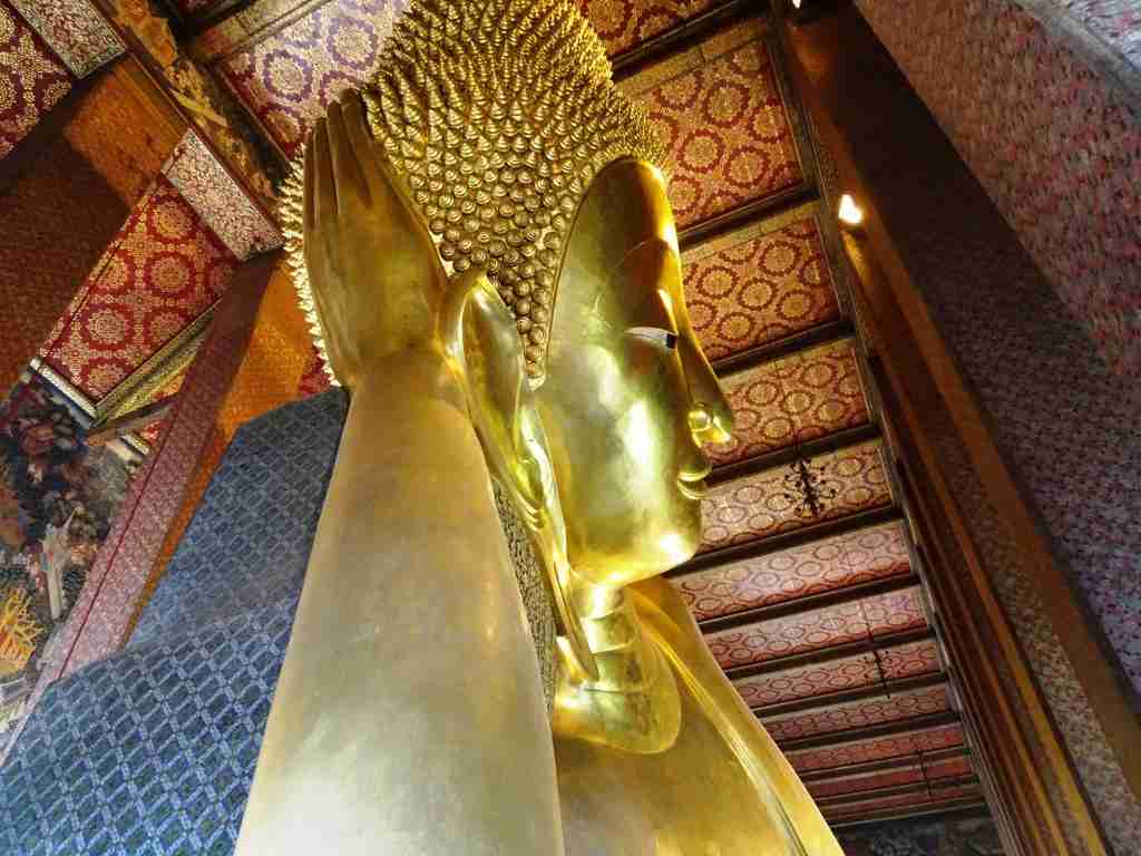 travel in Thailand and see the Wat Pho reclining Buddha