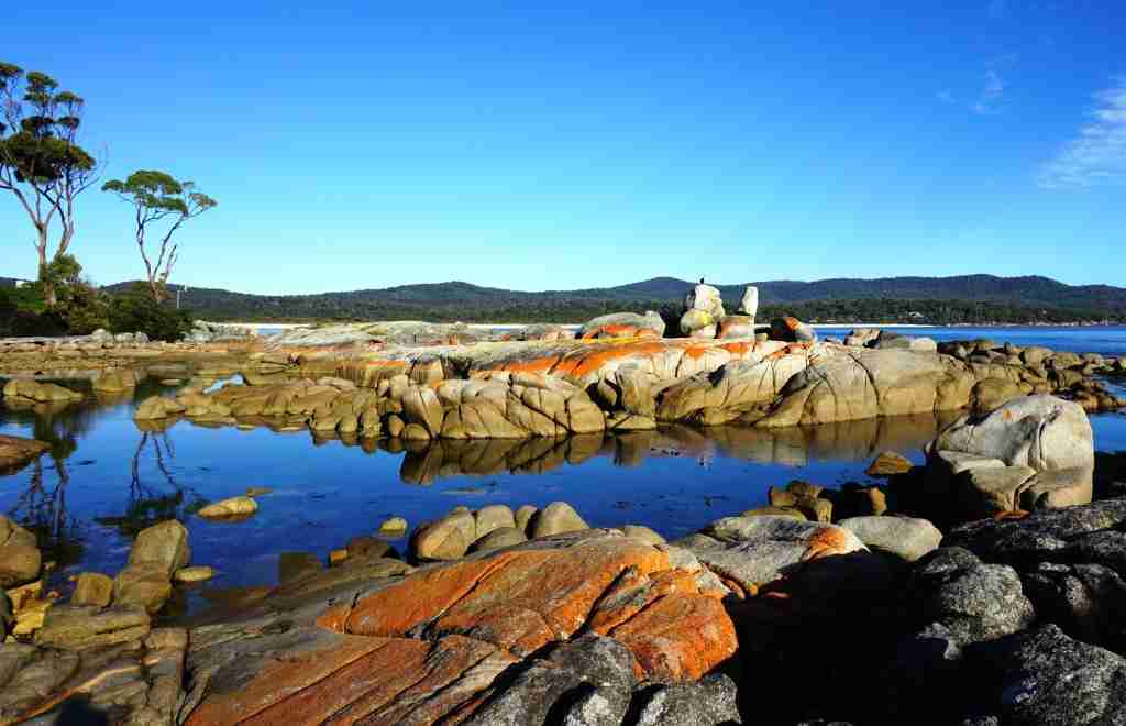 Betautiful Bay of Fires orange lichen covered rocks, blue water and open skies