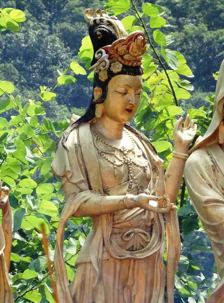 a life size statue of Kwun Yam, the Goddess of Mercy