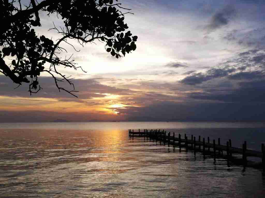 a beautiful sunset over the water in Kep Cambodia