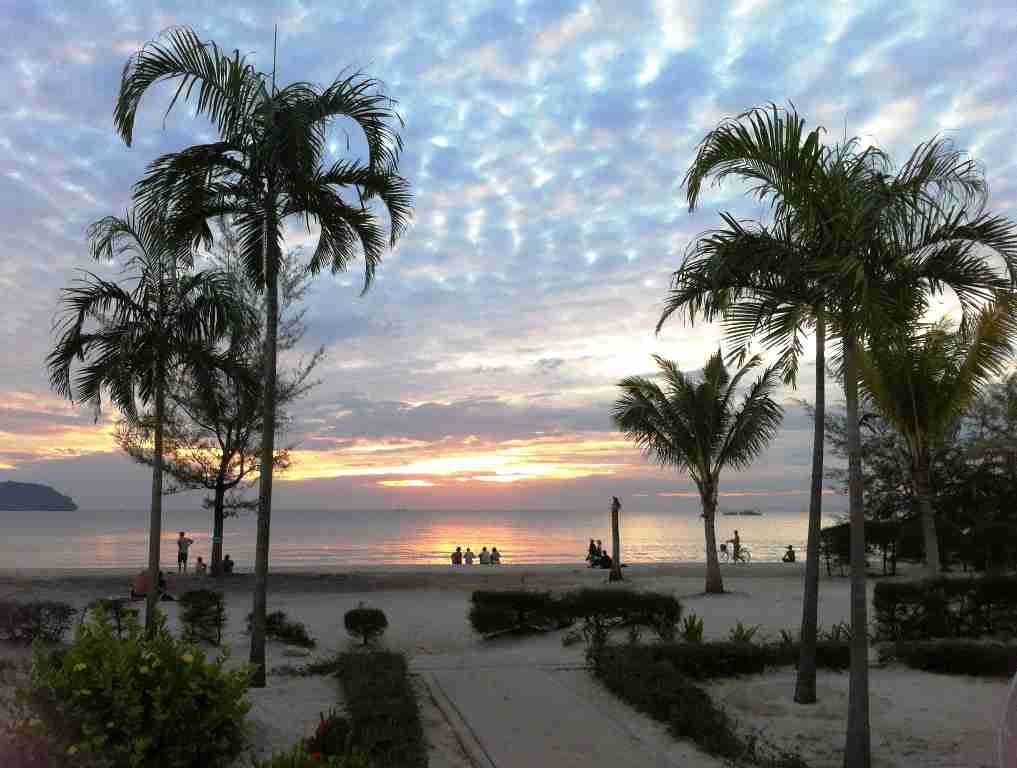 palm trees lining the beach and sunset views at Otres Beach Cambodia