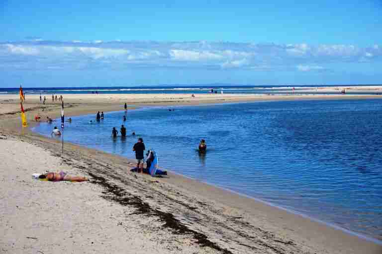 people swimming at Caloundra Beach near Brisbane in Australia