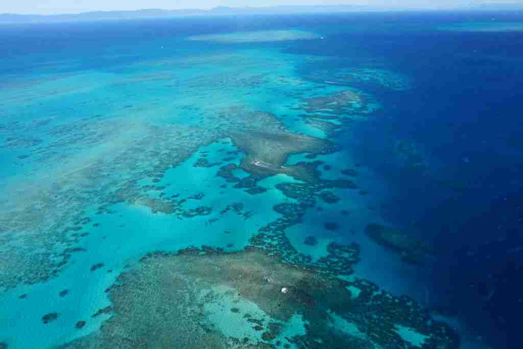 The Great Barrier Reef from the air with aqua and bright blue water