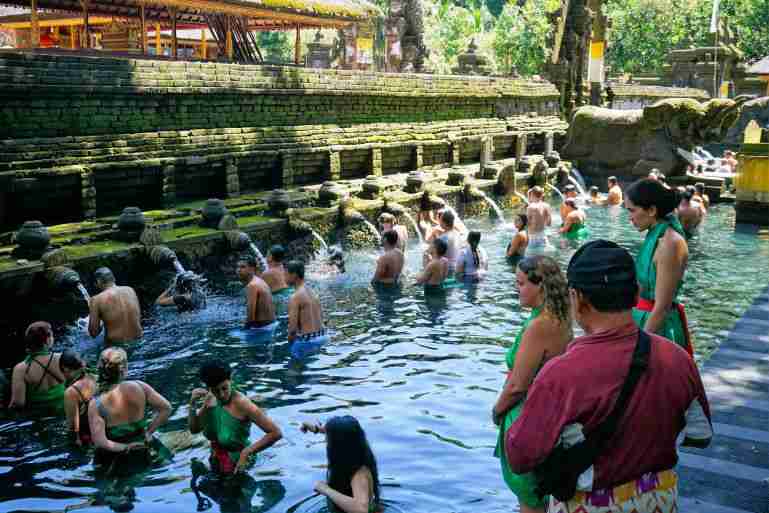 Cleasing ritual in the holy spring water at Tirta Empul Temple Bali