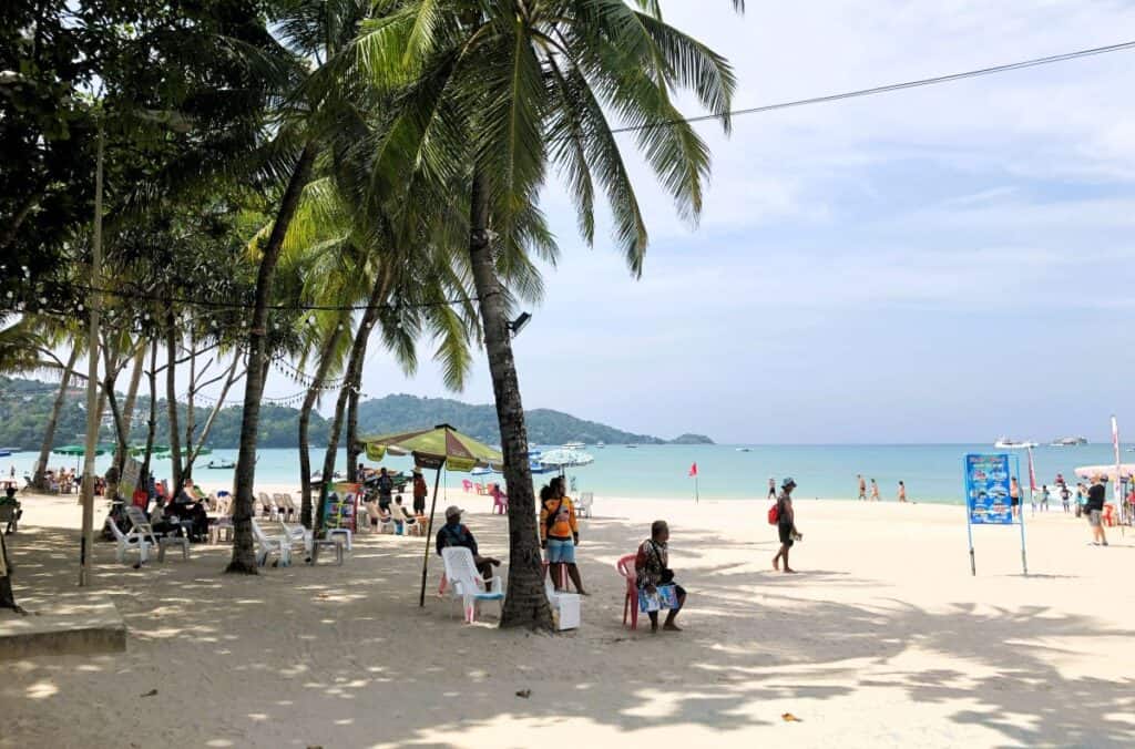 palm trees and white sand at Patong Beach Phuket Thailand