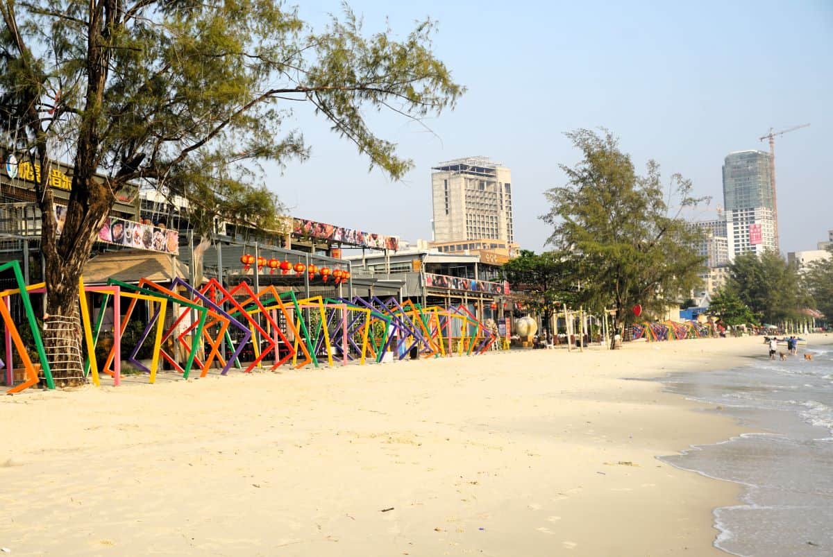 golden sandy beach with backed by buildings