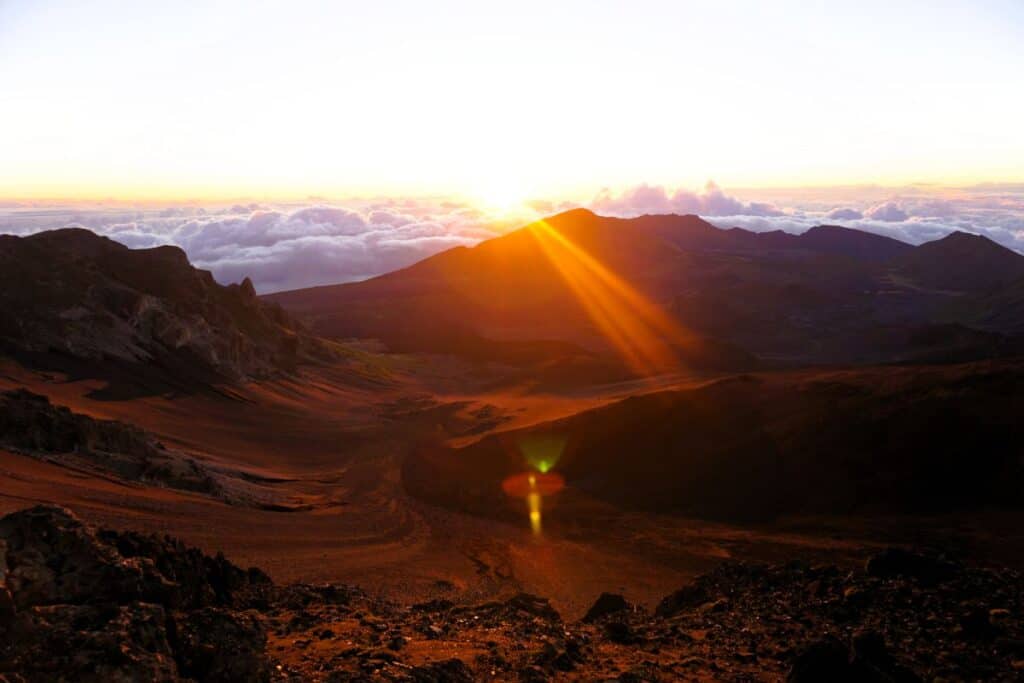 Beautiful sunrise over Haleakala Maui with the first rays illuminating the volcanic crater