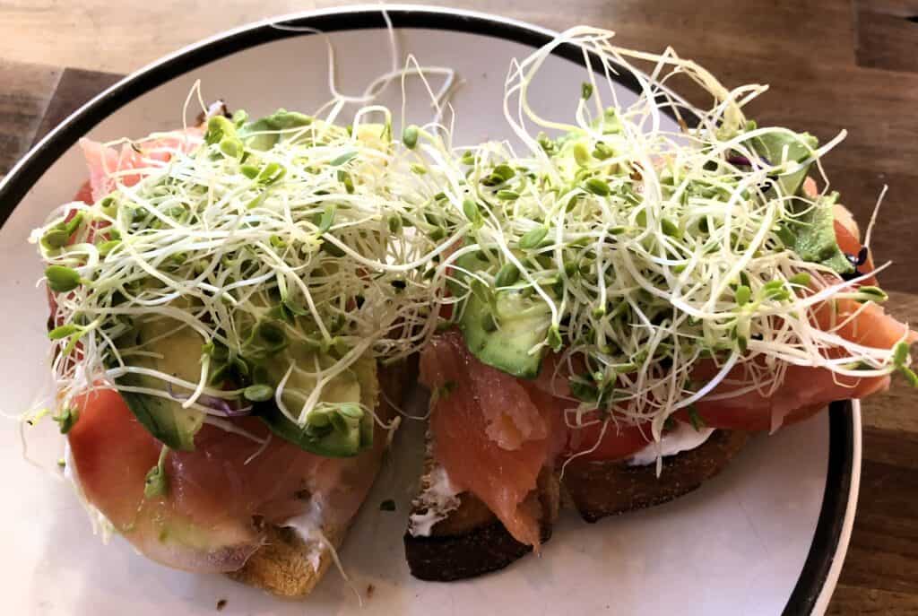 Open sandwich with smoked salmon and bean sprouts