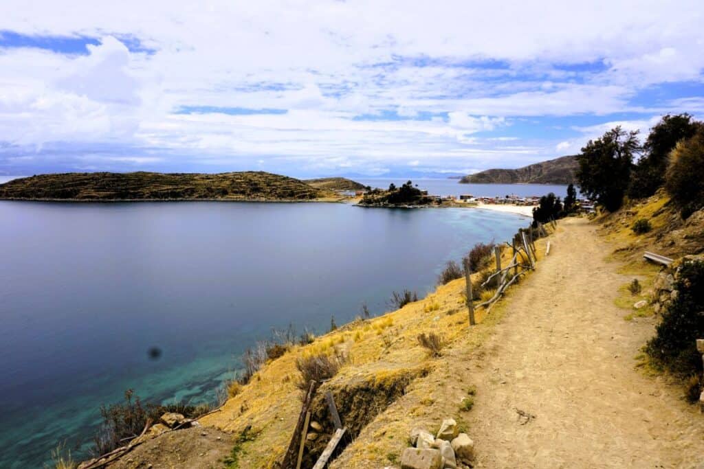blue lake and golden hills Lake Titicaca